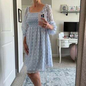 Baby blue dress with Pom appliqué.